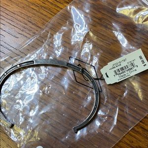 Fossil antique inspired stainless steel open cuff